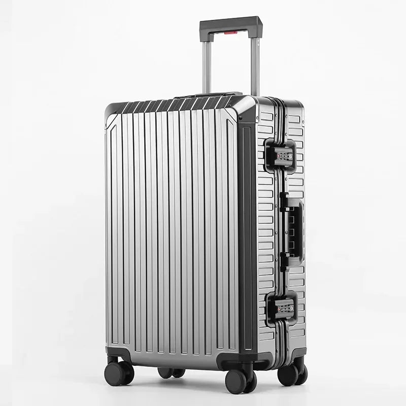 Silver hard shell suitcase with spinner wheels and telescopic handle on white background